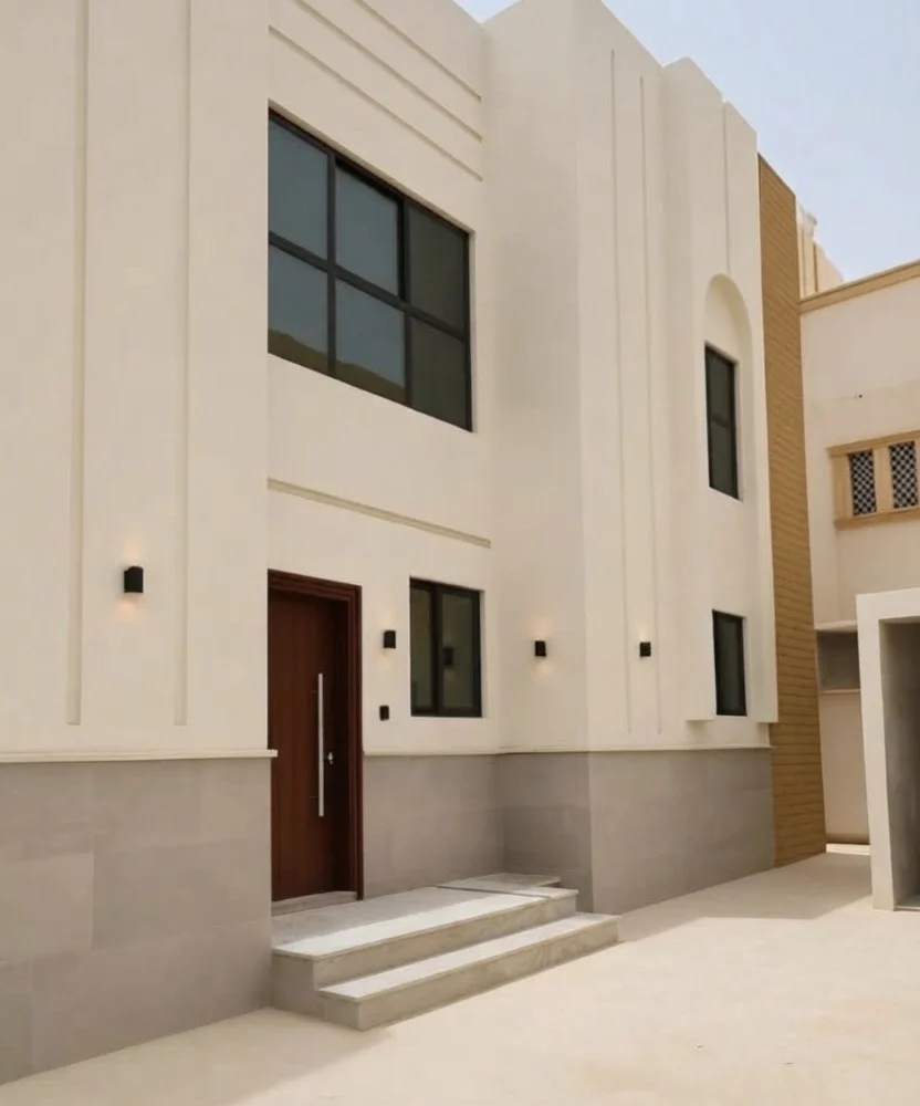 واجهة منزل حديث بعد تنفيذ أعمال الدهانات والديكورات الخارجية في الرياض.